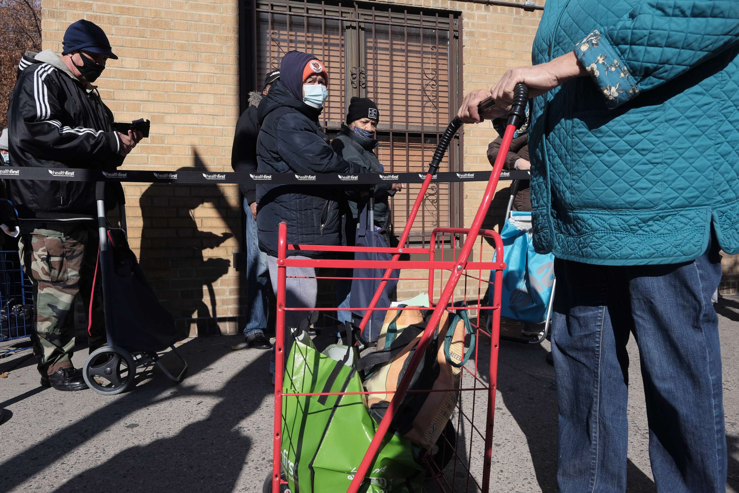 PHOTO: People line up to receive a free Thanksgiving turkey in the Washington Heights neighborhood of New York City, Nov. 23, 2021.