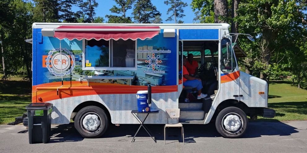 PHOTO: Students line up to a food truck providing free meals by Danville Public Schools in Virginia, June 11, 2019. 