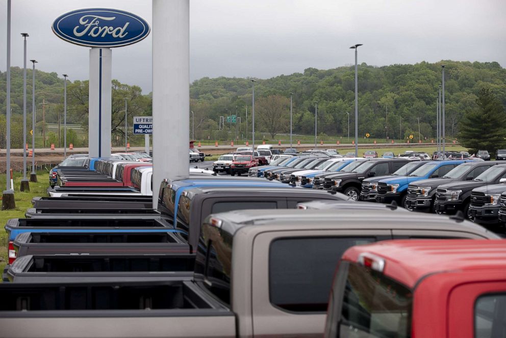 PHOTO: In this May 14, 2020, file photo, Ford trucks sit on display at a car dealership in Peoria, Illinois.