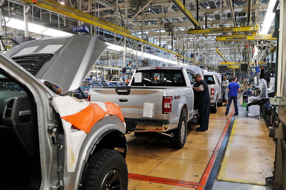 PHOTO: United Auto Workers assemblymen work on a 2018 Ford F-150 trucks being assembled at the Ford Rouge assembly plant in Dearborn, Mich., Sept. 27, 2018.