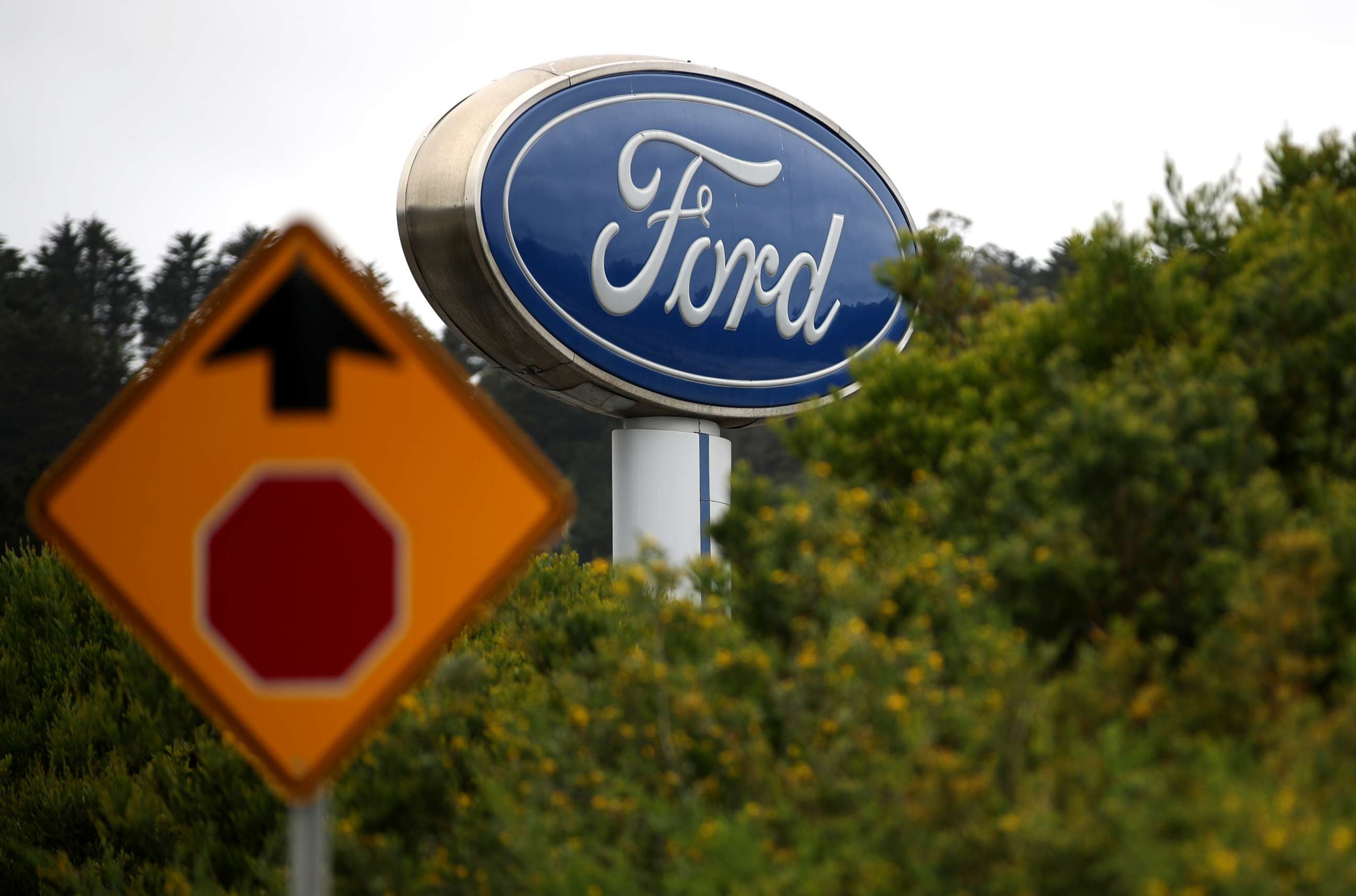 PHOTO: A sign with the Ford logo is posted in front of a dealership in Northern California, May 20, 2019.