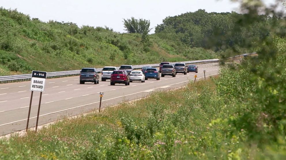 PHOTO: A group of vehicles follow each other on a track at the Ford Michigan Proving Grounds.