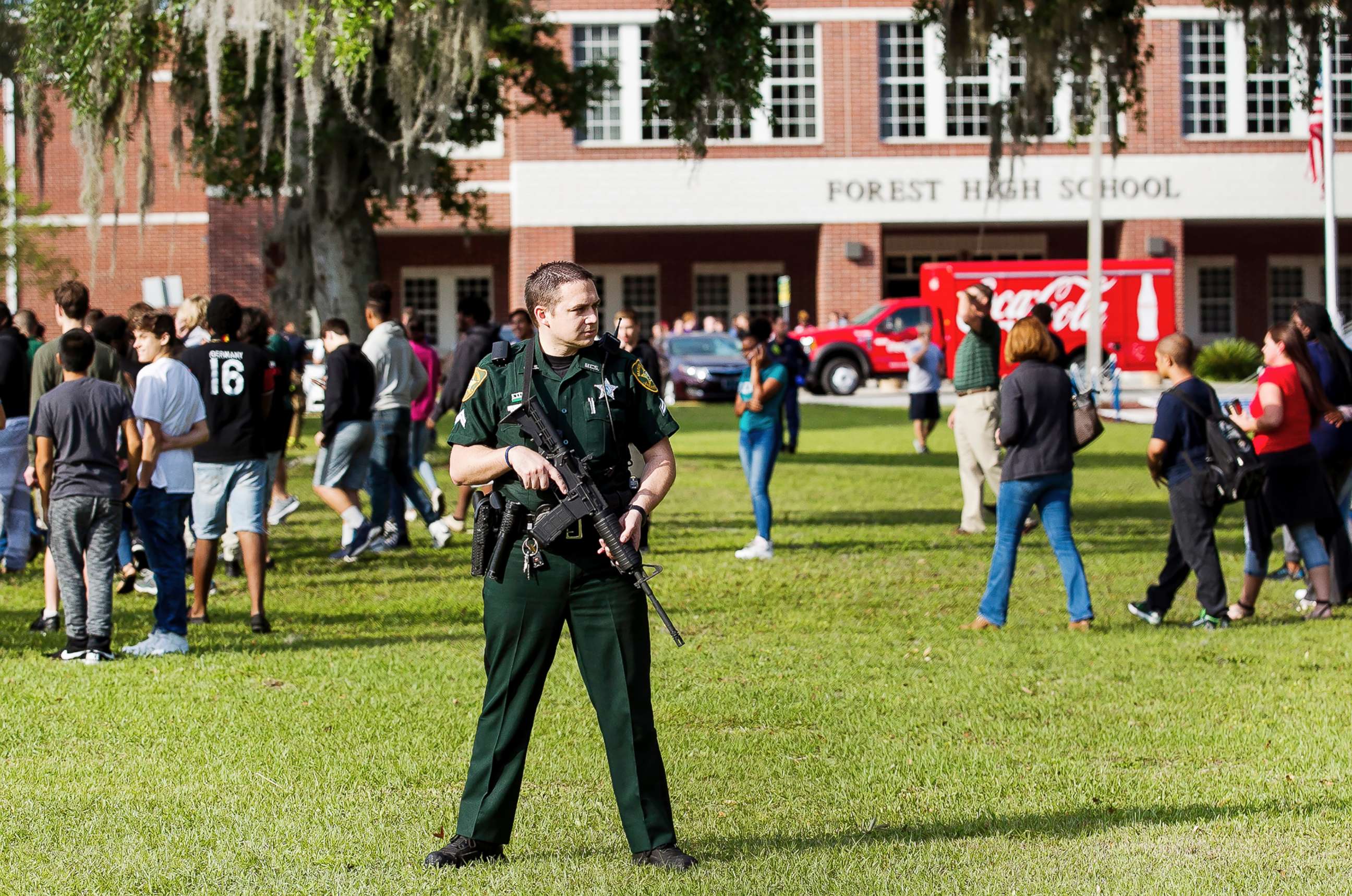 PHOTO: A Marion County Sheriff's Deputy stands outside Forest High School as students exit the school after a school shooting occurred on April 20, 2018 in Ocala, Fla.
