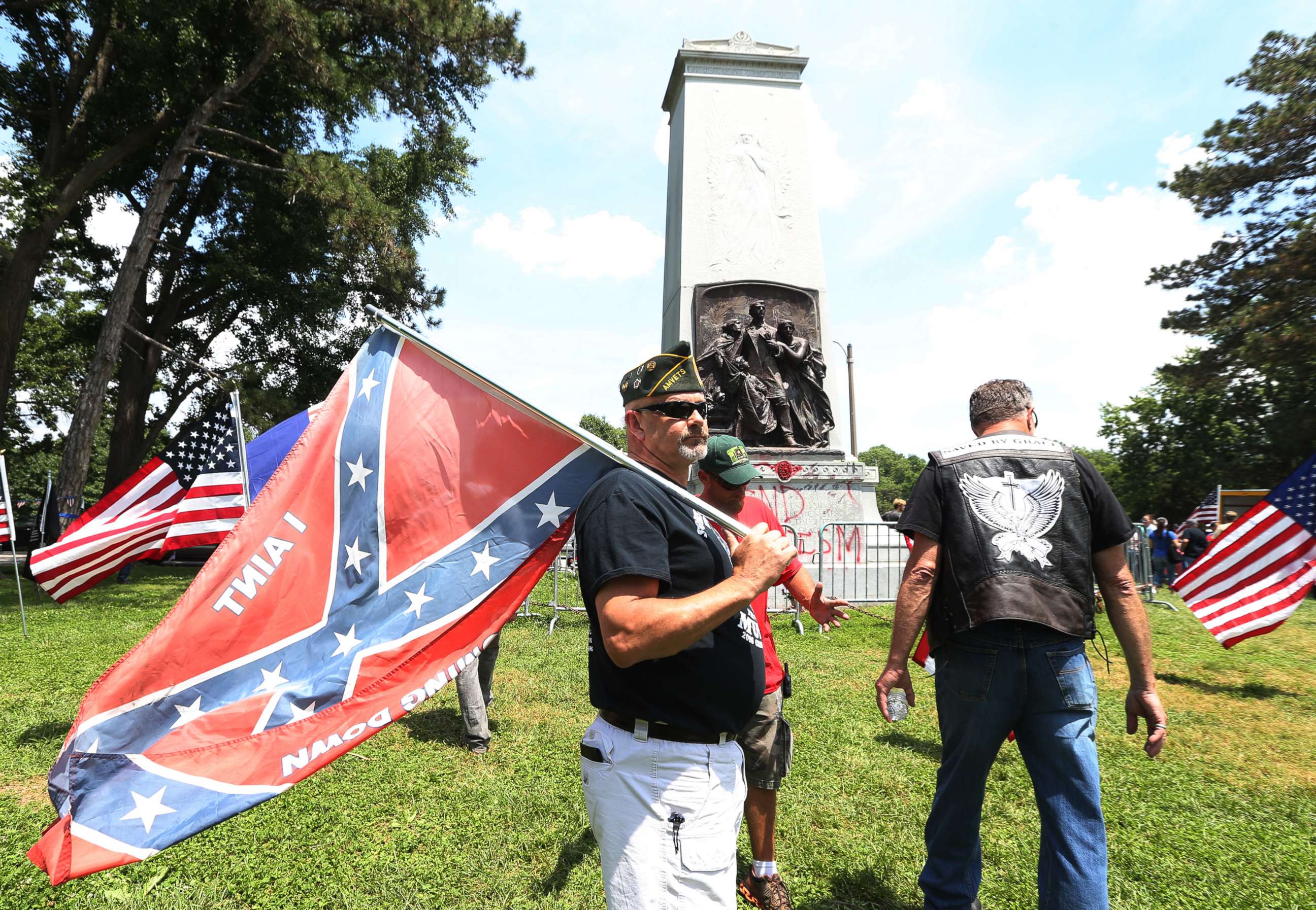 PHOTO: Steve Stepanek of St. Louis waves a Confederate flag at the Confederate monument in Forest Park on June 3, 2017 in St. Louis.