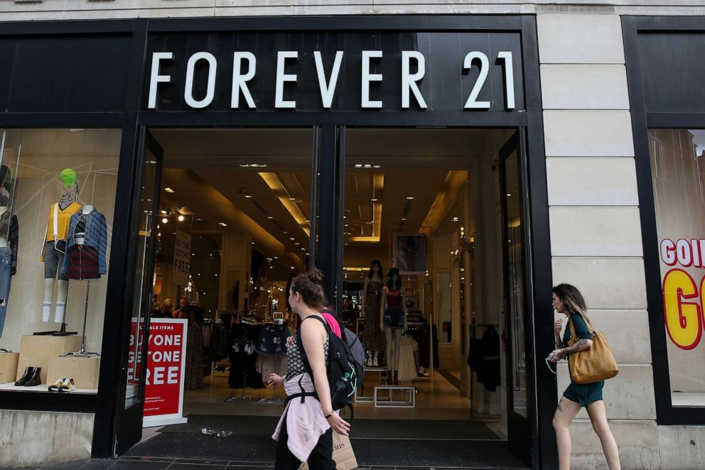 PHOTO: Shoppers walk past a branch of Forever 21 store in London, Aug. 9, 2019. 