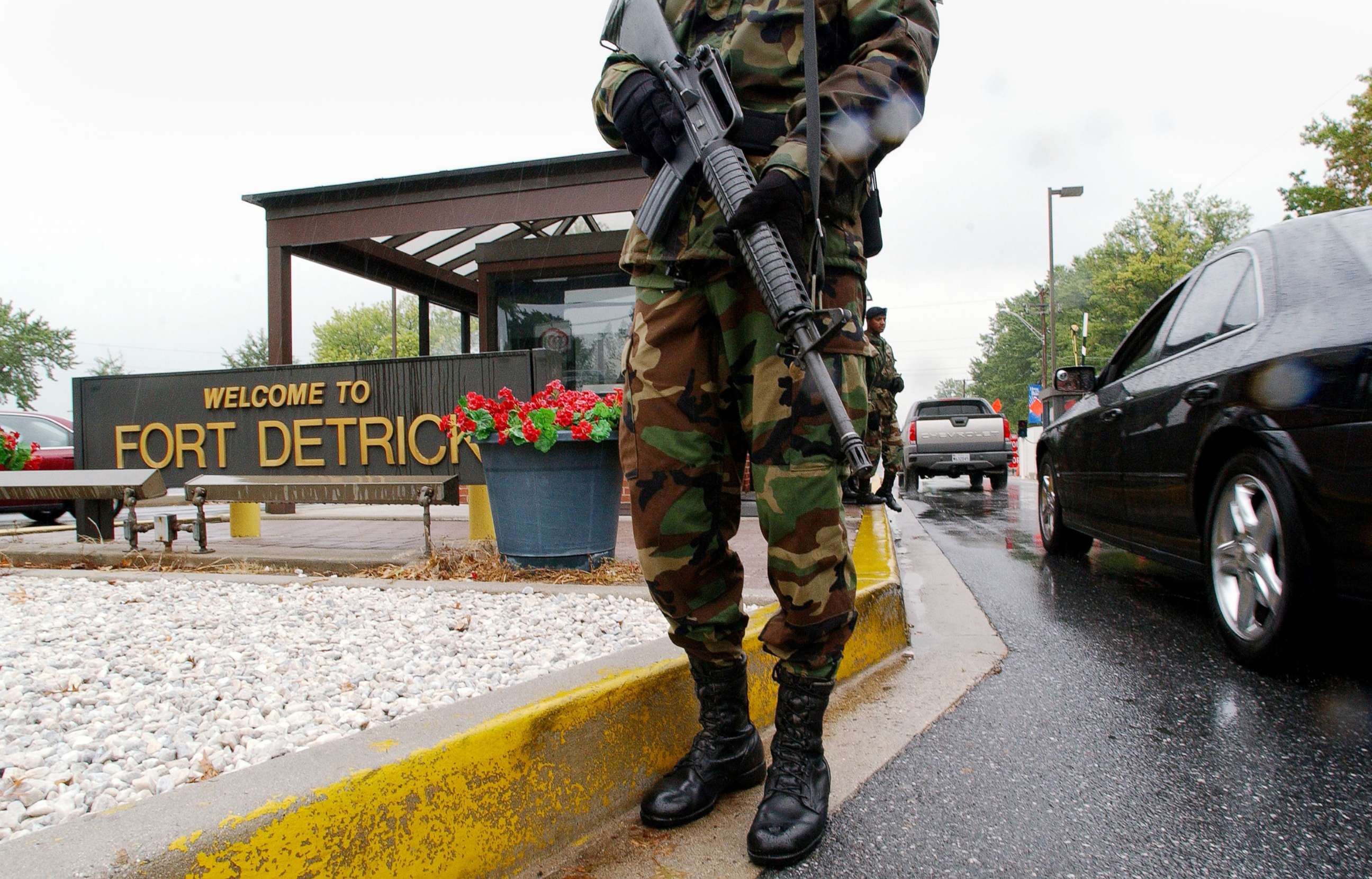 PHOTO: Military Personnel stand guard outside Fort Detrick, in Frederick, Md., Sept. 26, 2002.