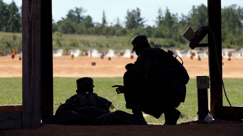 PHOTO: A U.S. Army recruit is instructed by a drill sergeant, right, during live-fire marksmanship training at Fort Jackson, S.C., Aug. 17, 2016.