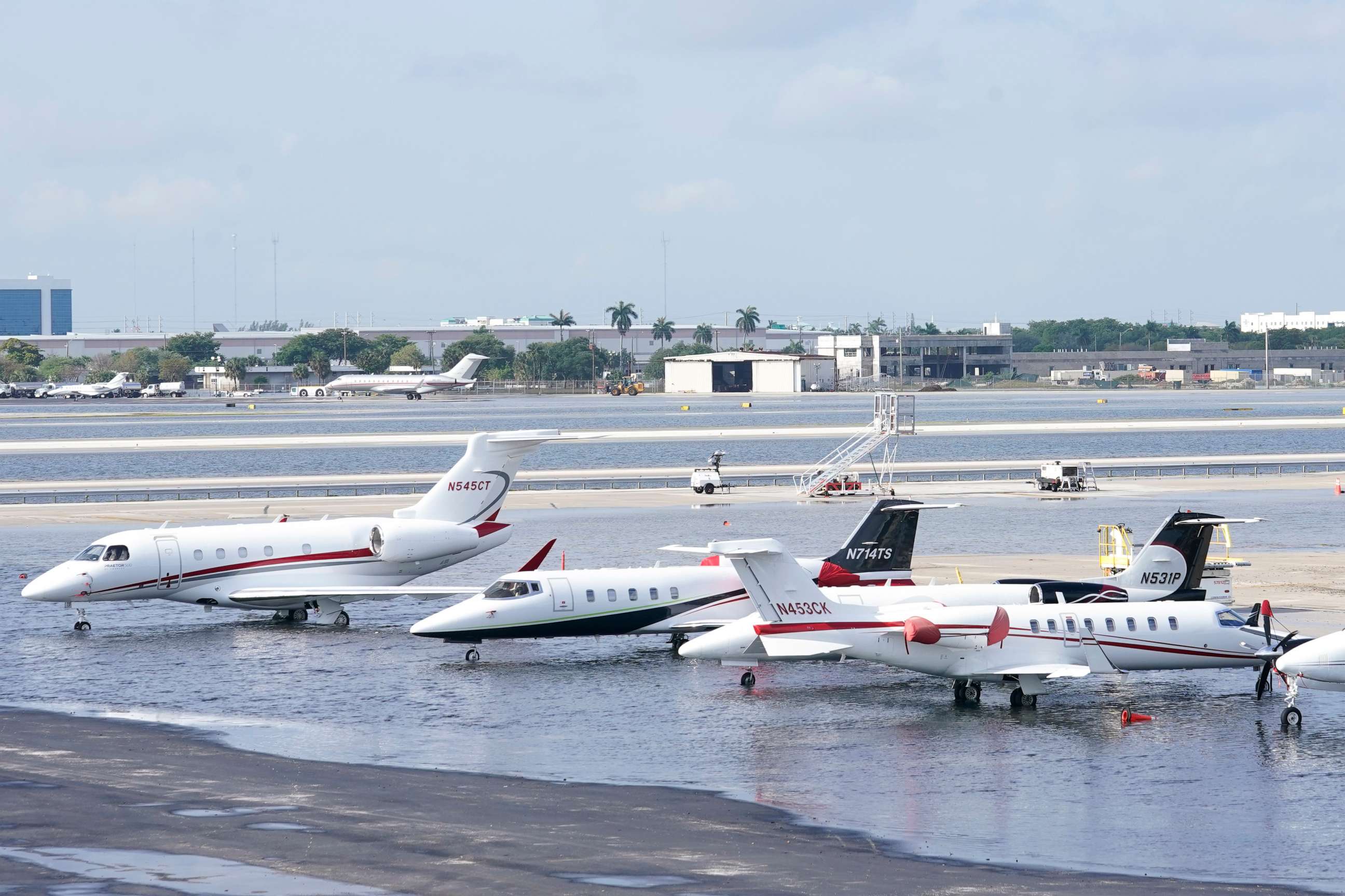 PHOTO: Small planes are parked at Fort Lauderdale-Hollywood International Airport, after the airport was force to shut down due to flooding, Thursday, April 13, 2023, in Fort Lauderdale, Fla.