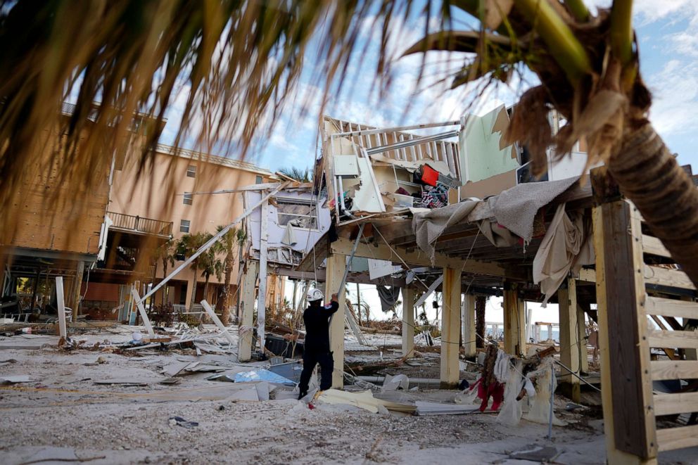 PHOTO: A member of Florida Task Force 8 urban search and rescue tags a condominium building that has been checked and found clear of people, in Fort Myers Beach, Fla., Oct. 5, 2022, one week after the passage of Hurricane Ian.