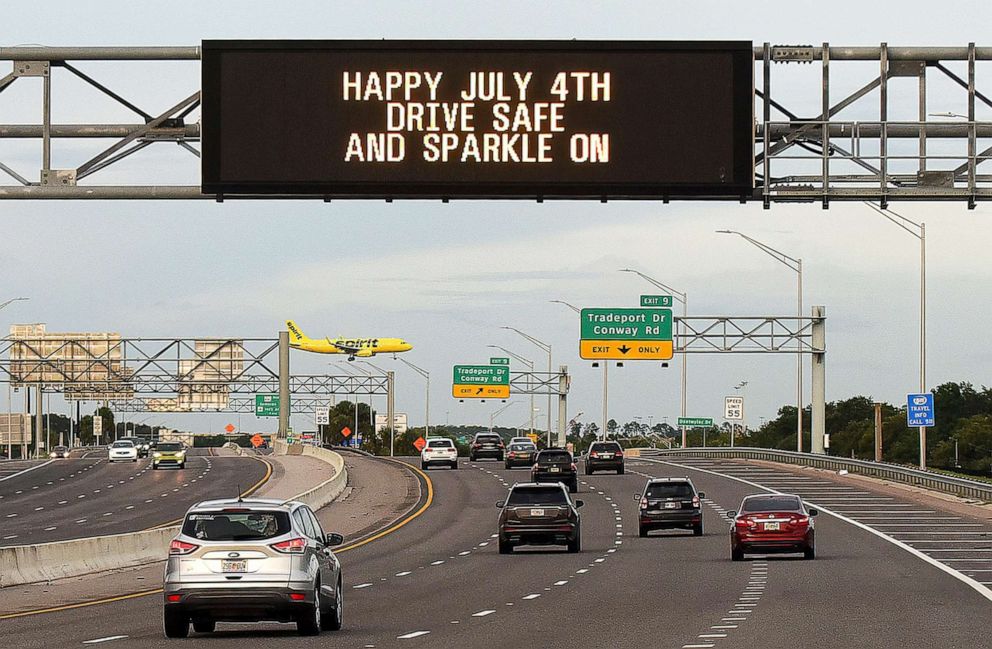 PHOTO: A "Happy July 4th" sign greets drivers near Orlando International Airport as the holiday weekend begins in Orlando, Fla., July 2, 2021.