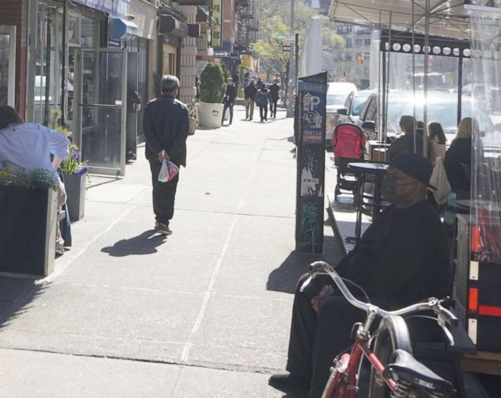 PHOTO: In this image posted to Twitter, someone matching the description of Frank James is shown walking down the street in New York, on April 13, 2022.