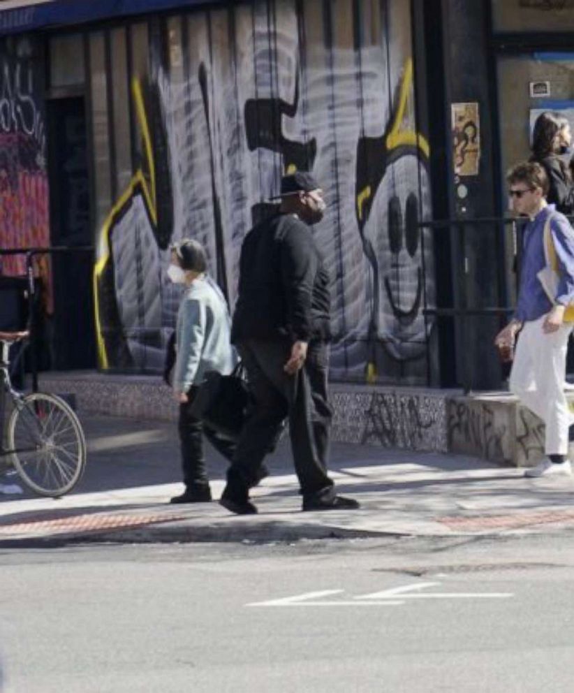 PHOTO: In this image posted to Twitter, someone matching the description of Frank James is shown walking down the street in New York, on April 13, 2022.