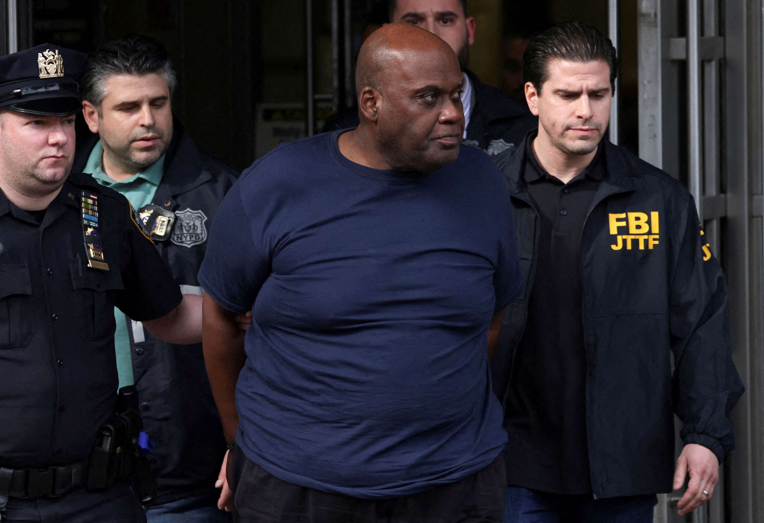 PHOTO: Frank James, the suspect in the Brooklyn subway shooting walks outside a police precinct in New York, on April 13, 2022.