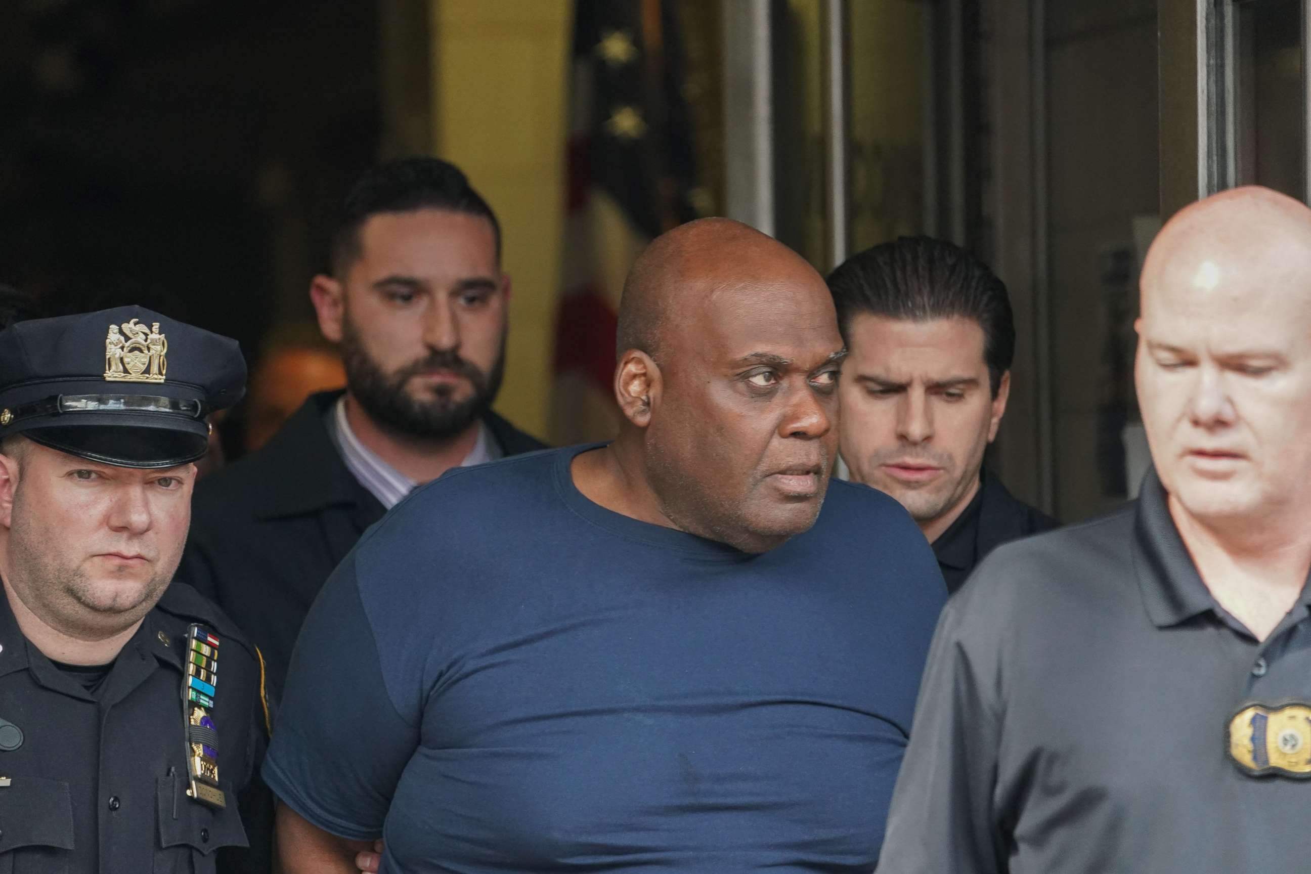 PHOTO: In this file photo taken on April 13, 2022, Frank James, 62, is led away from the 9th Precinct into Federal Custody in New York City after he was arrested on the Lower East Side in Manhattan by two patrol officers.