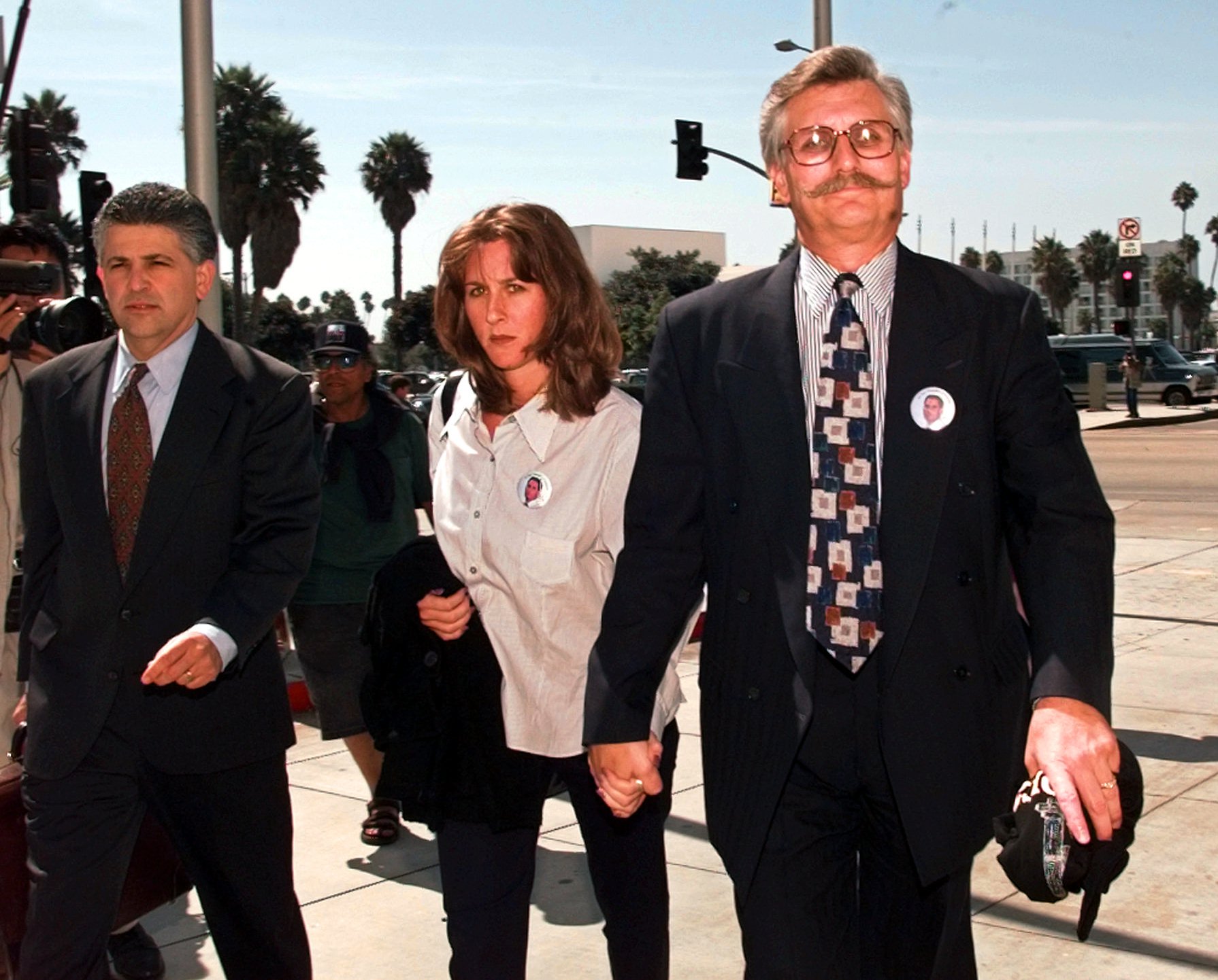 PHOTO: Fred Goldman, right, and his daughter Kim, leave Los Angeles County Superior Court along with their attorney Daniel Petrocelli following pre-trial hearings in the wrongful-death case against O.J. Simpson, Sept. 17, 1996, in Santa Monica, Calif. 