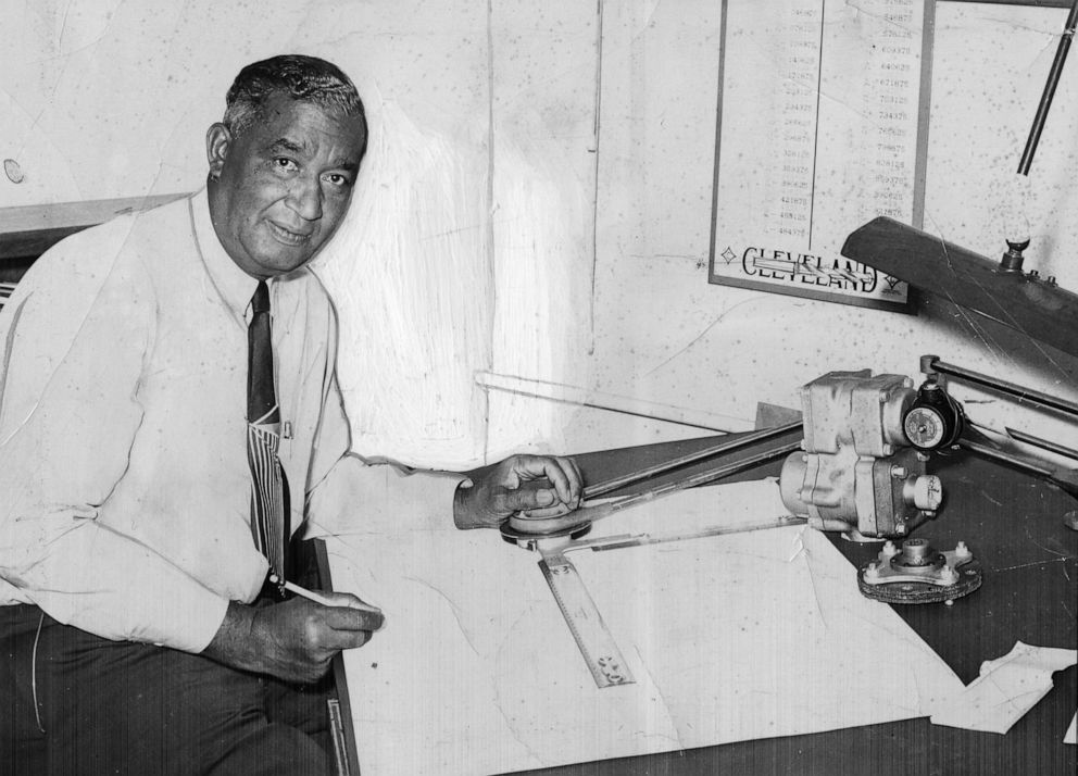 PHOTO: Frederick Jones works on plans for a thermal control device, 1955.