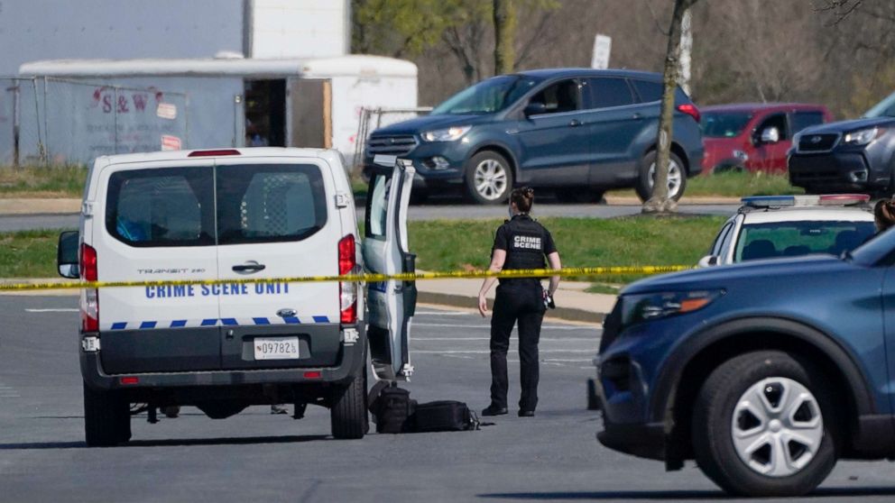 PHOTO: A crime scene technician stands near the scene of a shooting at a business park in Frederick, Md., April 6, 2021.