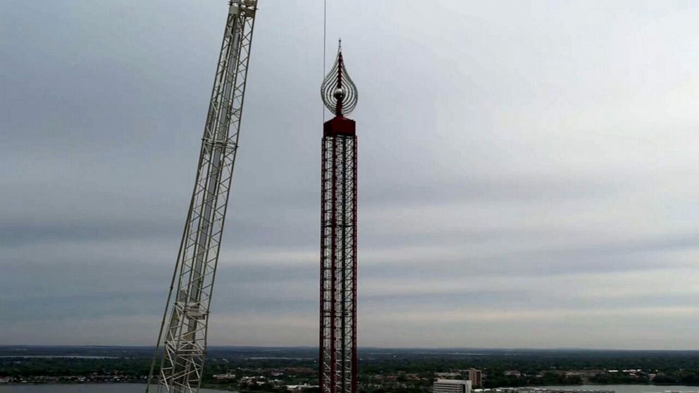 PHOTO: Crews work to dismantle the Orlando FreeFall ride at ICON Park, March 15, 2023.