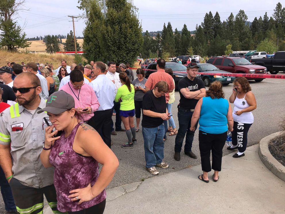 PHOTO: Parents gather in the parking lot behind Freeman High School in Rockford, Wash. to wait for their children, after a deadly shooting at the school on Sept. 13, 2017.