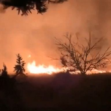 Strong winds whipped up flames late Tuesday night.