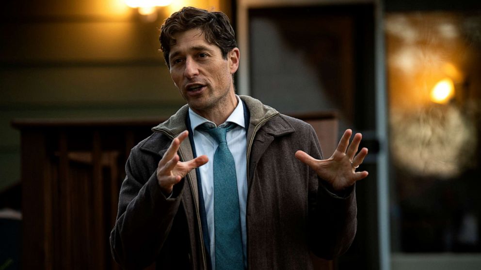 PHOTO: Minneapolis mayor Jacob Frey speaks with constituents at a backyard campaign event, Oct. 26, 2021, in Minneapolis.