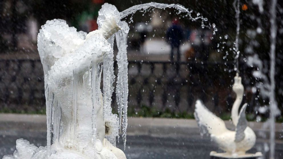 PHOTO: A frozen fountain in Historic Forsyth Park still works despite freezing temperatures and rain, Jan. 3, 2018, in Savannah, Ga. 