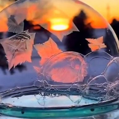 A soap bubble freezes in the chilly Minnesota weather, creating a beautiful 'snow globe.'