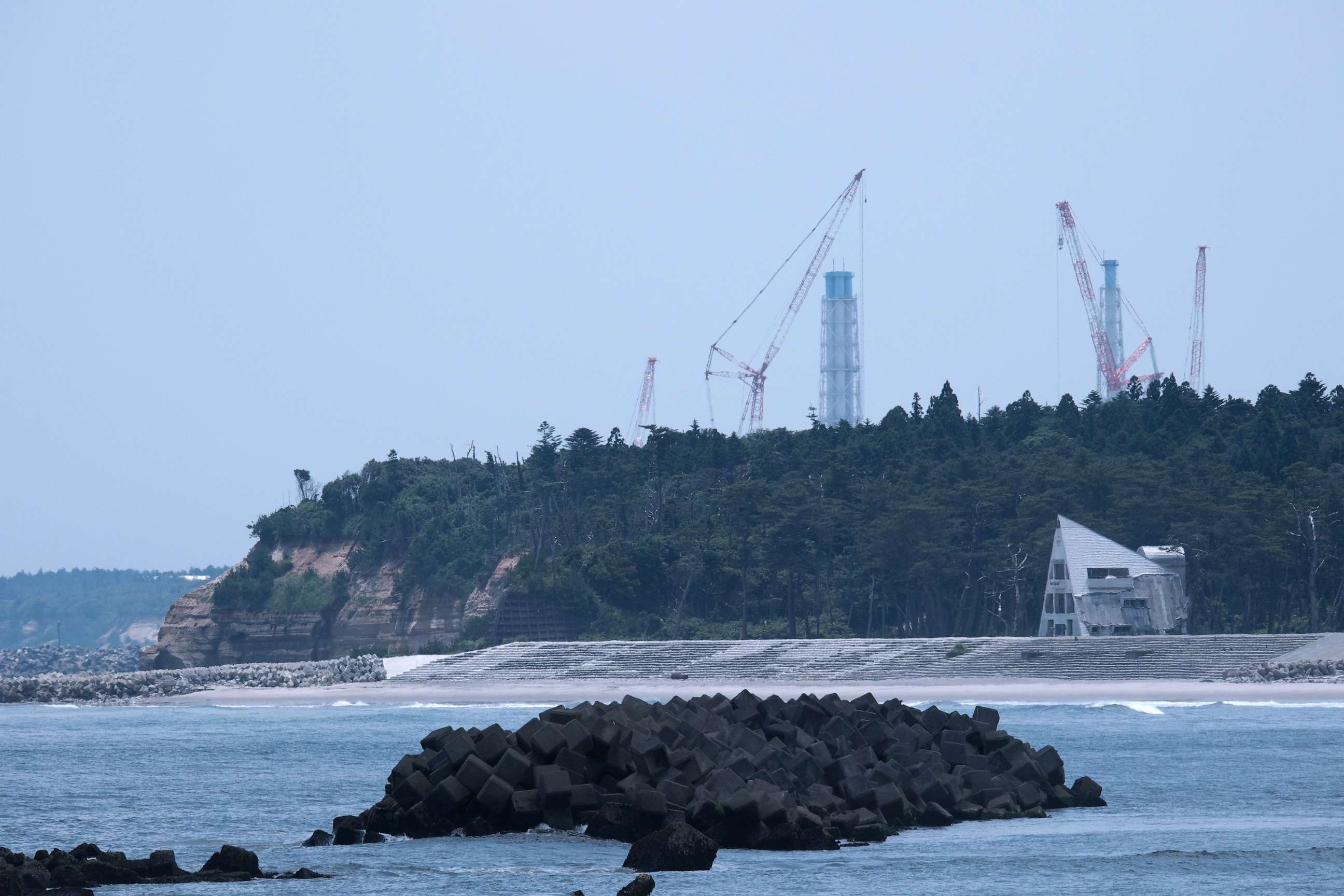 PHOTO: Tokyo Electric Power Co.'s (Tepco) Fukushima Dai-ichi nuclear power plant, rear, in Okuma, Fukushima Prefecture, Japan, July 3, 2023.
