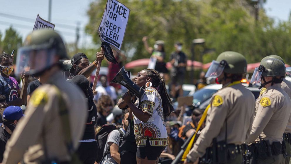 PHOTO: Officers block marchers from continuing down E. Palmdale Boulevard (State Route 138) after a demonstration, June 13, 2020, in Palmdale, Calif.