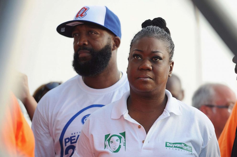 PHOTO: Tracy Martin and Sybrina Fulton, right, parents of slain Florida teenager Trayvon Martin, await to speak at an event in St. Louis, Aug. 24, 2014.