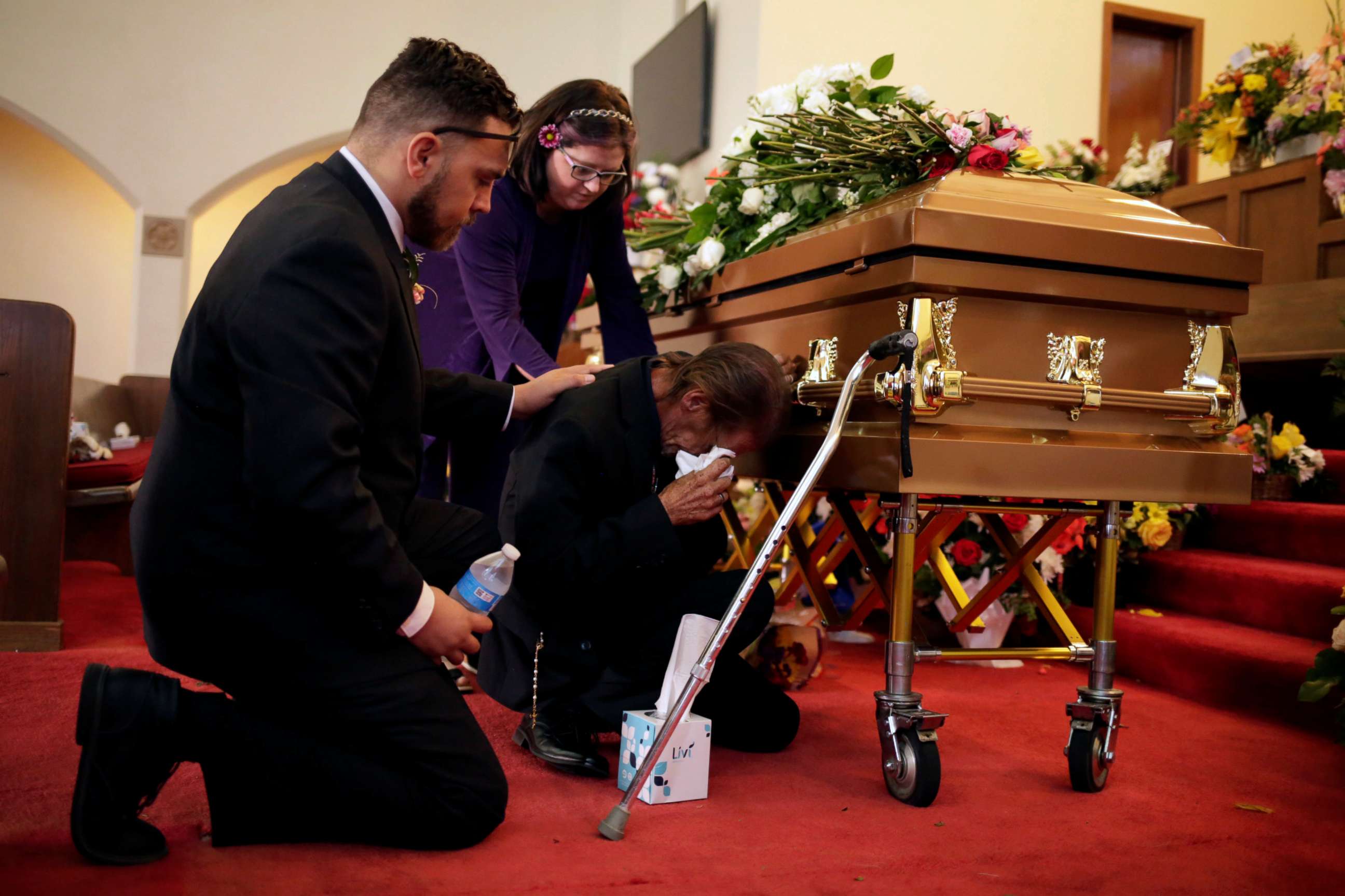 PHOTO: Antonio Basco is comforted during the wake of his wife Margie Reckard, murdered during a shooting at a Walmart store, in El Paso, Texas, U.S. August 17, 2019.