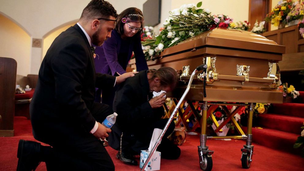 PHOTO: Antonio Basco is comforted during the wake of his wife Margie Reckard, murdered during a shooting at a Walmart store, in El Paso, Texas, U.S. August 17, 2019.