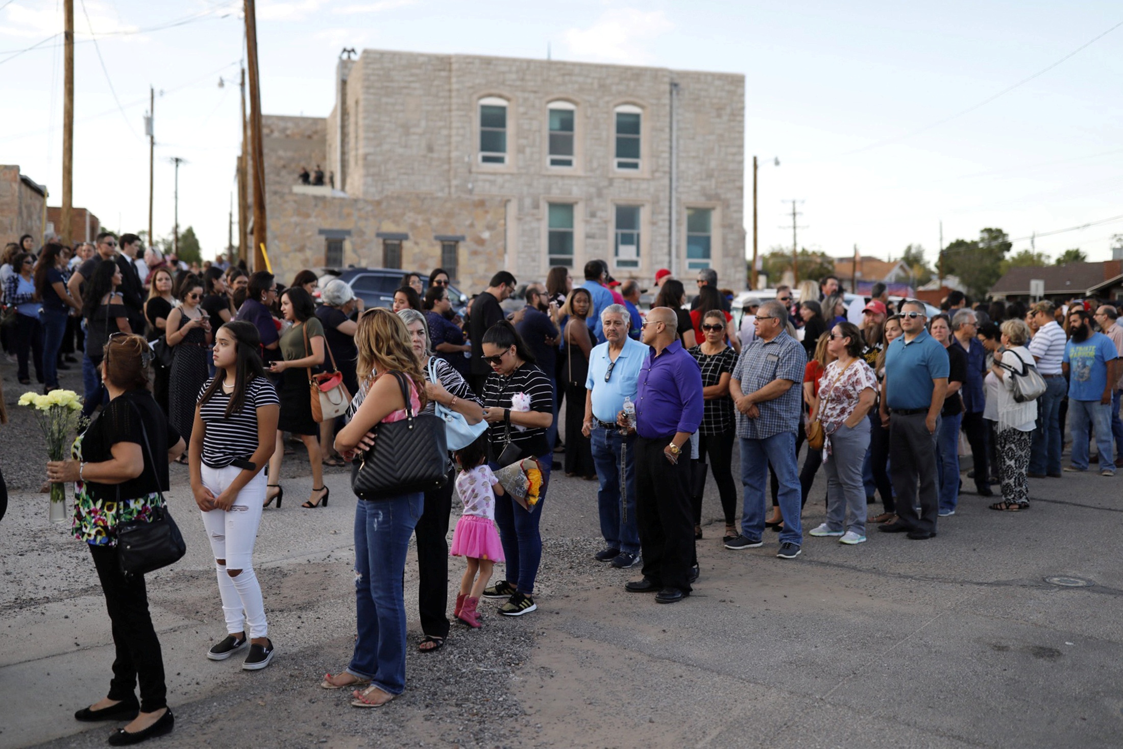 PHOTO: Mourners form a line outside the La Paz Faith memorial center during the public visitation service of Walmart shooting victim Margie Reckard, to which her husband Antonio Basco had invited the community in El Paso, Texas, U.S. August 16, 2019.