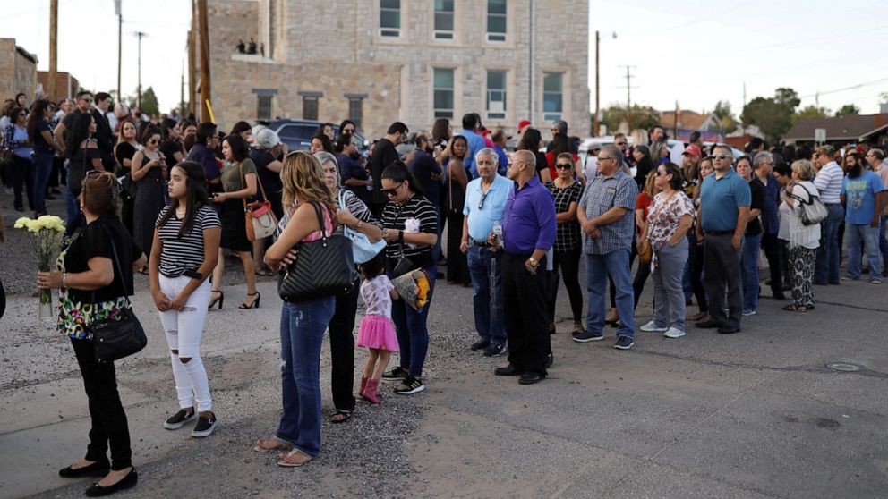 PHOTO: Mourners form a line outside the La Paz Faith memorial center during the public visitation service of Walmart shooting victim Margie Reckard, to which her husband Antonio Basco had invited the community in El Paso, Texas, U.S. August 16, 2019.