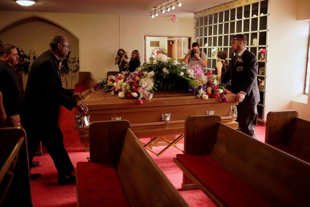 PHOTO: Two men carry the coffin containing the body of his wife Margie Reckard, murdered during a shooting at a Walmart store, during her wake in El Paso, Texas, U.S. August 17, 2019.