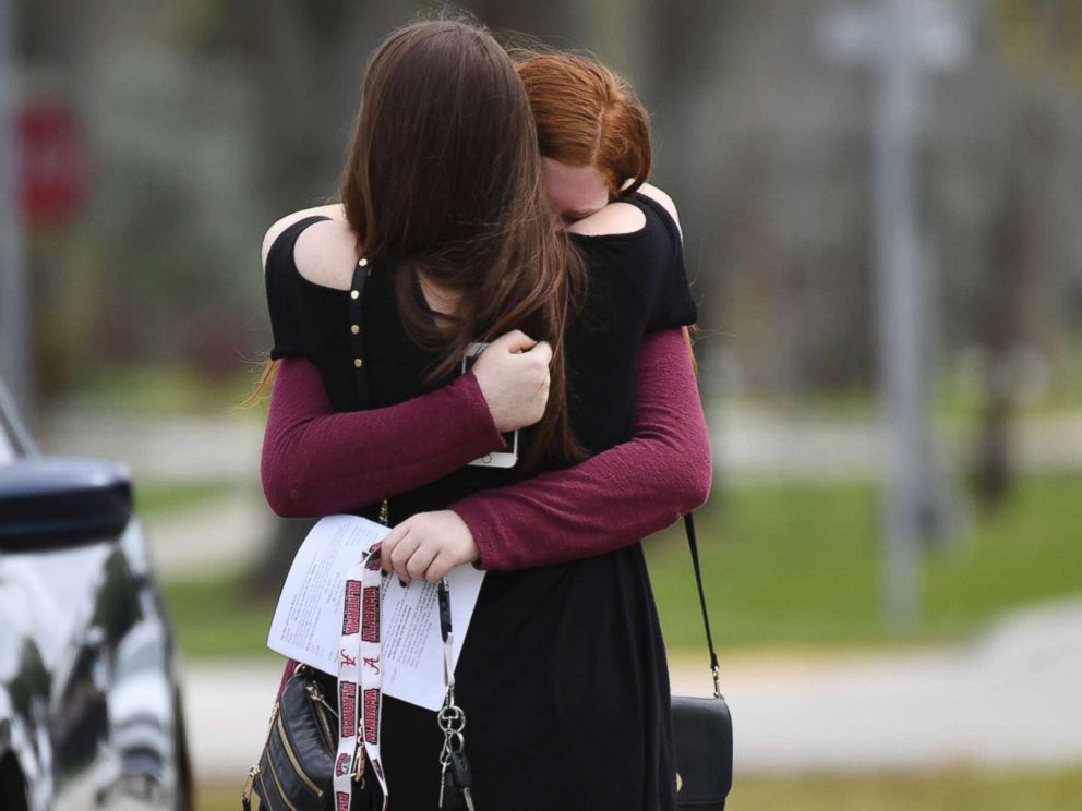 PHOTO: Mourners react as they leave the funeral services for slain Marjory Stoneman Douglas student Carmen Schentrup, Feb. 20, 2018, at St. Andrew Catholic Church in Coral Springs, Fla. 