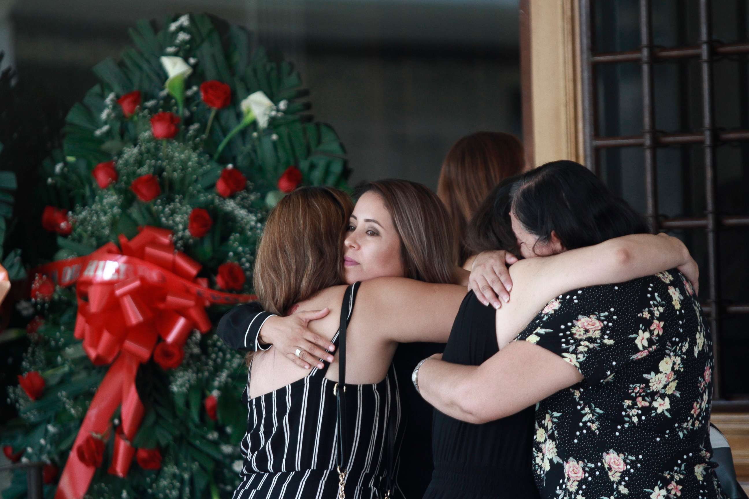 PHOTO: Tearful mourners hug outside a funeral home as they arrive to attend a wake for Elsa Mendoza, who was killed in the El Paso mass shooting, in Juarez, Mexico, Aug. 7, 2019. 