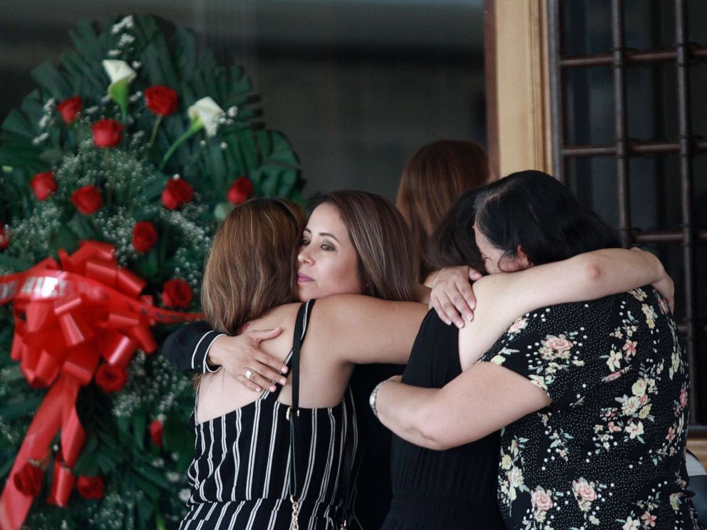 PHOTO: Tearful mourners hug outside a funeral home as they arrive to attend a wake for Elsa Mendoza, who was killed in the El Paso mass shooting, in Juarez, Mexico, Aug. 7, 2019.