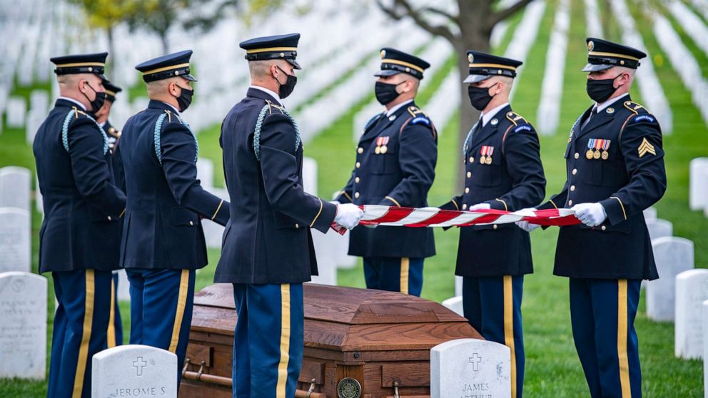 Soldiers assigned to 1st Battalion, 3d U.S. Infantry Regiment (The Old Guard) conduct modified military funeral honors for U.S. Army Retired Command Sgt. Maj. Robert M. Belch in Section 68 of Arlington National Cemetery, Arlington, Va., April 14, 2020.