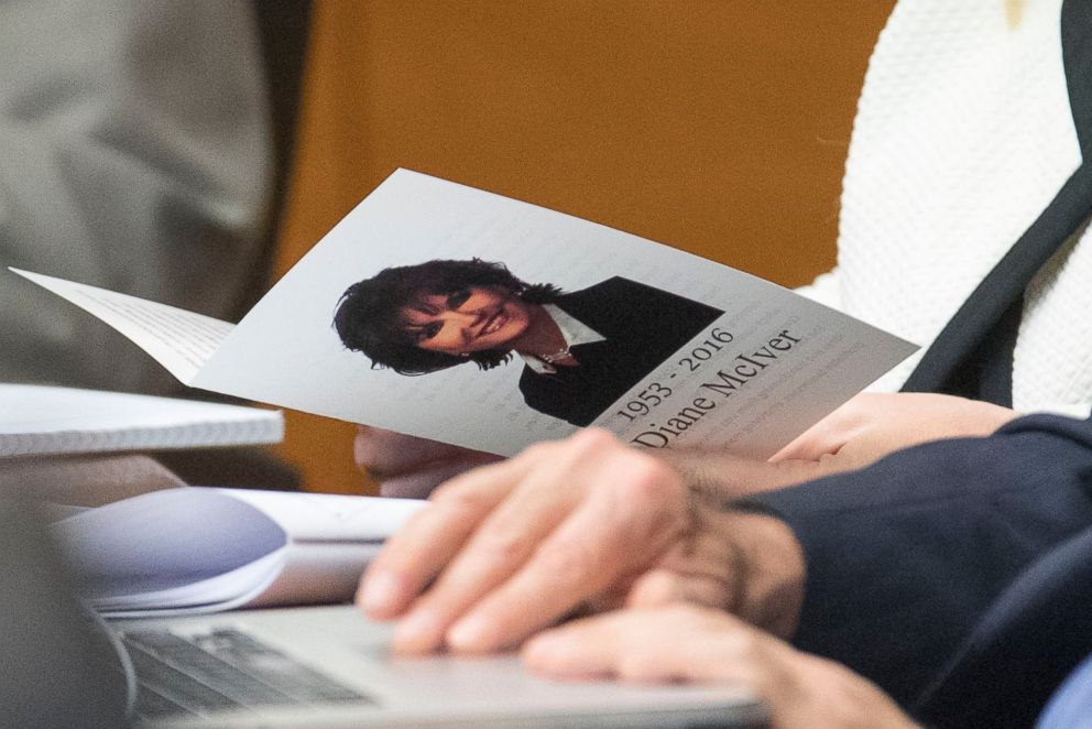 PHOTO: A funeral pamphlet for Diane McIver is perused at the defenses table during Tex McIver's trial, March 14, 2018, in Atlanta. 
