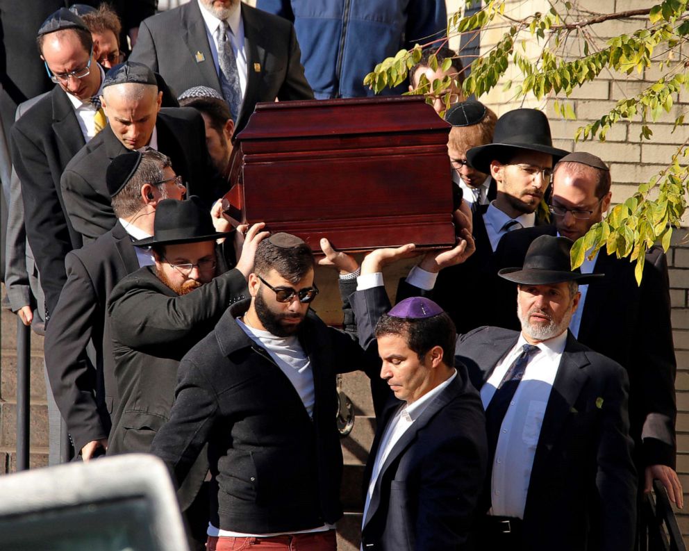 PHOTO: Pallbearers carry the casket of Joyce Fienberg from the Beth Shalom Synagogue following a funeral service in Pittsburgh, Oct. 31, 2018.