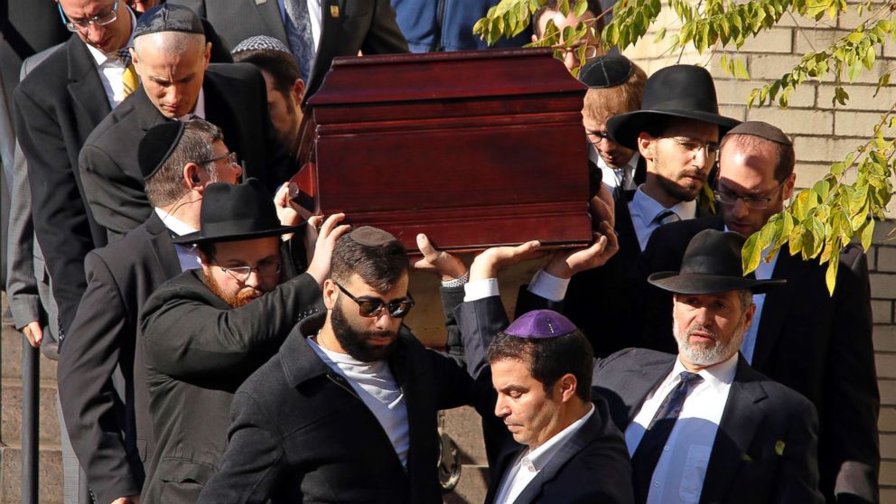 PHOTO: Pallbearers carry the casket of Joyce Fienberg from the Beth Shalom Synagogue following a funeral service in Pittsburgh, Oct. 31, 2018.