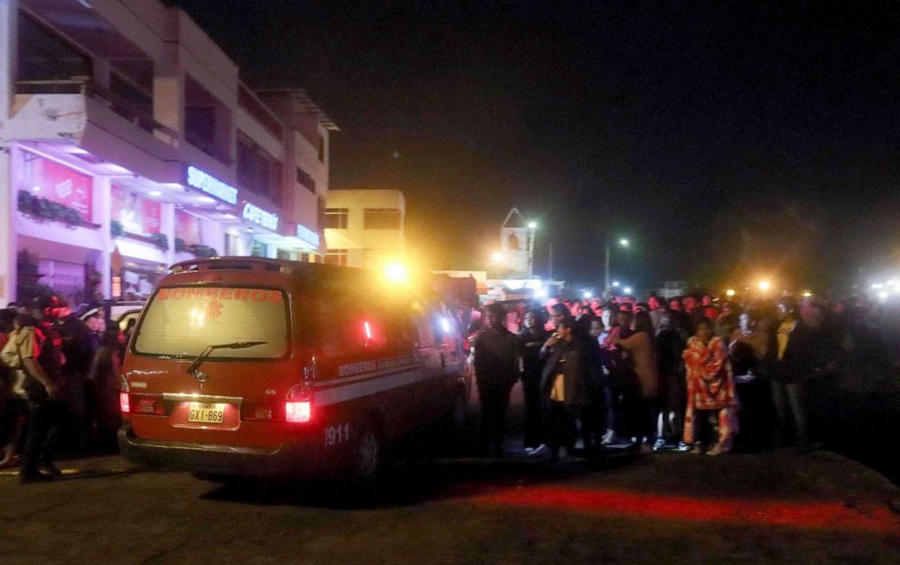 PHOTO: People gather at the port of Puerto Ayora in Santa Cruz Island, in the Galapagos Islands, after a boat with tourists sank in the archipelago located 1,000 km off the coast of Ecuador in the Pacific Ocean, on September 25, 2022.