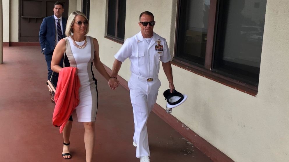 PHOTO: Navy Special Operations Chief Edward Gallagher, right, walks with his wife, Andrea Gallagher as they arrive for military court on Naval Base San Diego, Tuesday, June 18, 2019, in San Diego.