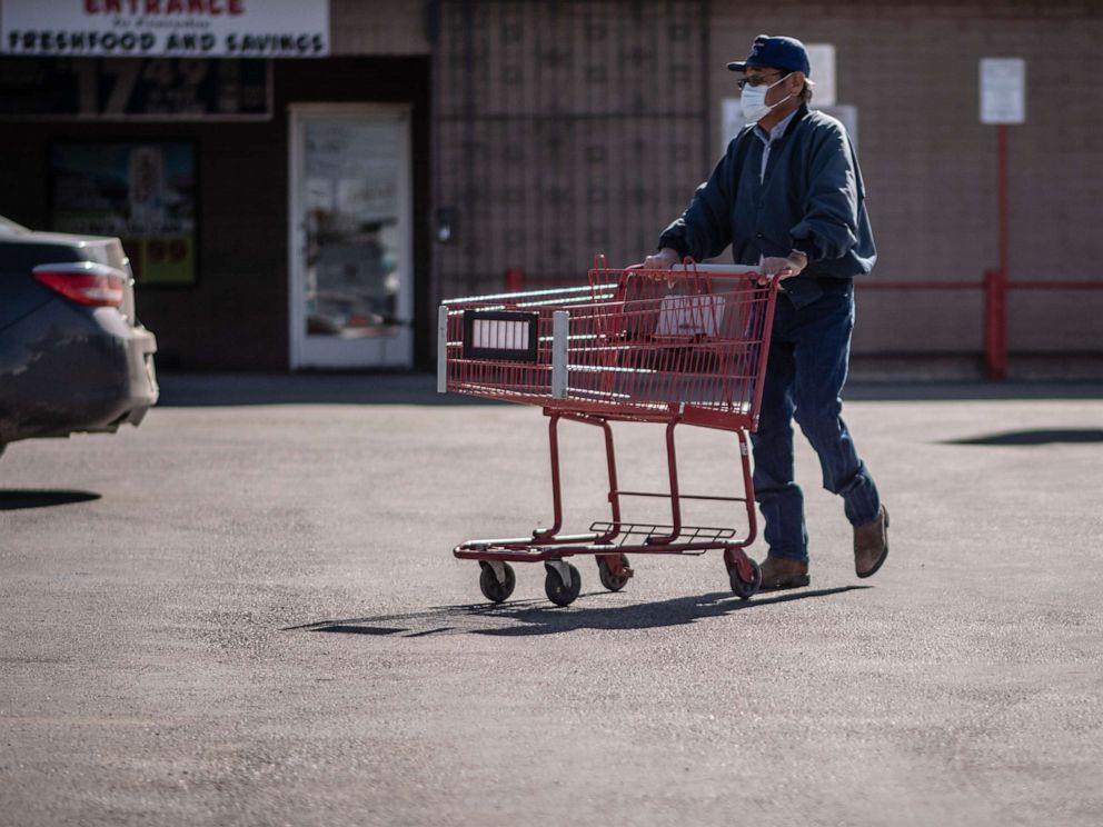 PHOTO: A man pushed a shopping cart in Gallup, N.M., April 3, 2020. 