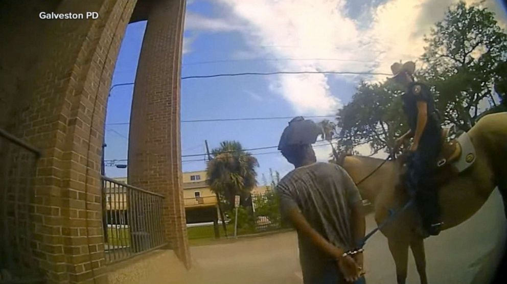 PHOTO: Galveston police released bodycam footage of Donald Neely being walked through Galveston by officers on horseback.