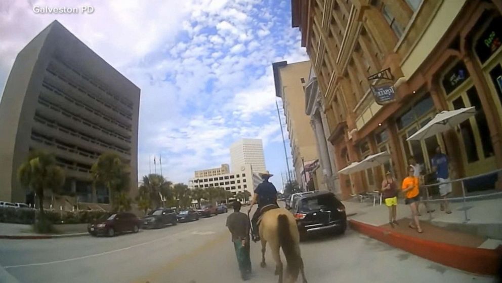 PHOTO: Galveston police released bodycam footage of Donald Neely being walked through Galveston by officers on horseback.