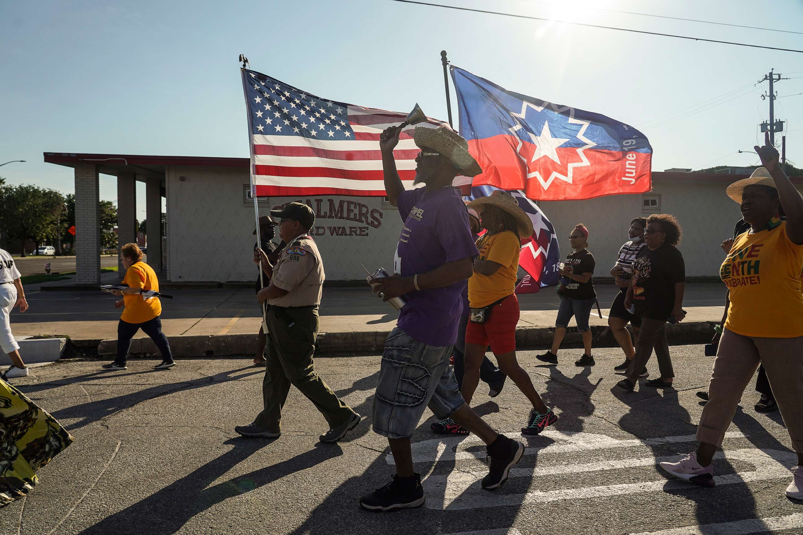 PHOTO: Members of Reedy Chapel African Methodist Episcopal Church march to celebrate Juneteenth on June 19, 2021 in Galveston, Texas.