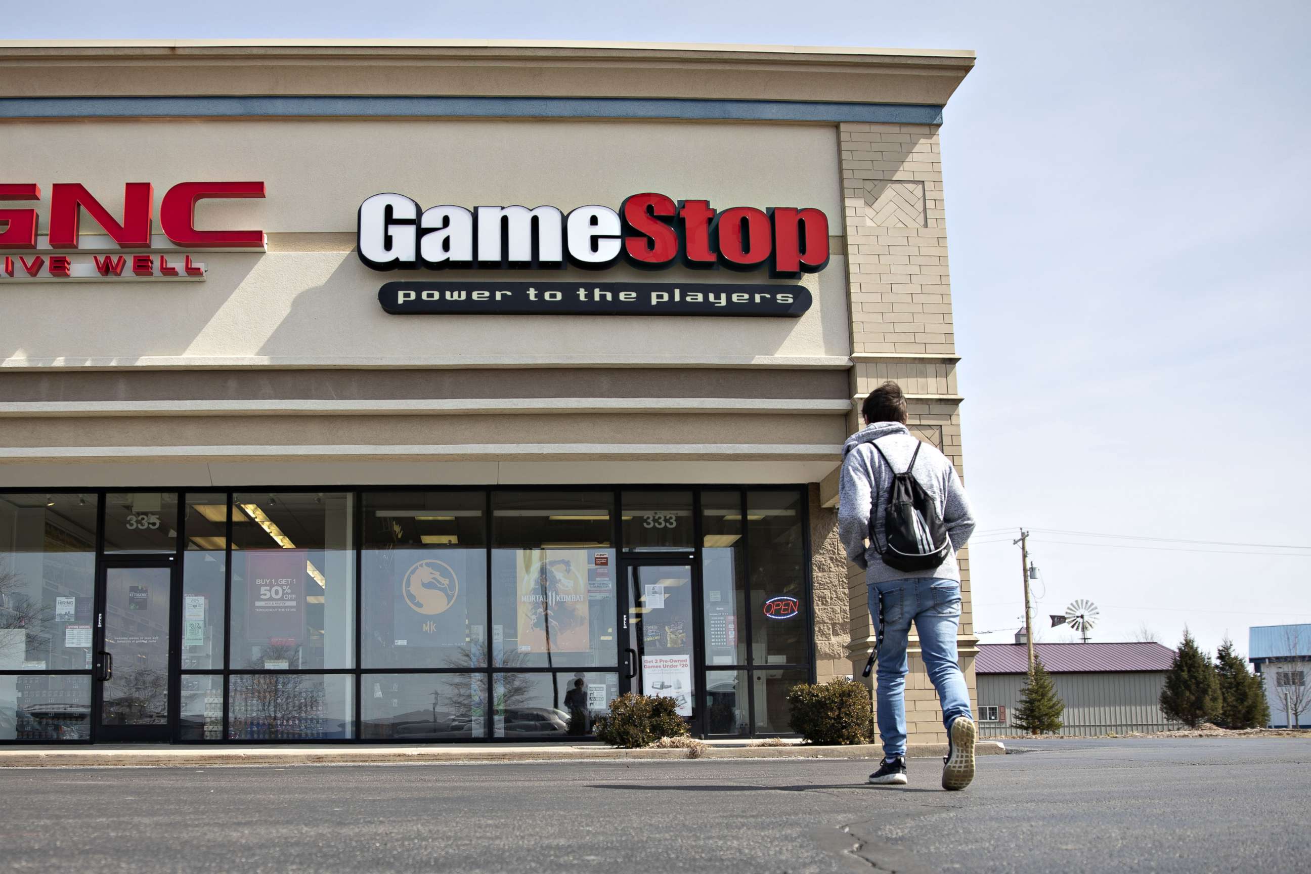 PHOTO: A shopper walks toward a GameStop store in Ottawa, Ill., April 1, 2019.