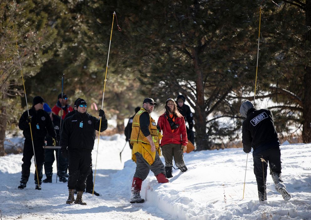 PHOTO: El Paso County Law enforcement and volunteers use poles to search snowy areas for 11-year-old missing Colorado Springs boy Gannon Stauch on private property in southern Douglas County near Larkspur Colo., on Feb. 13, 2020.